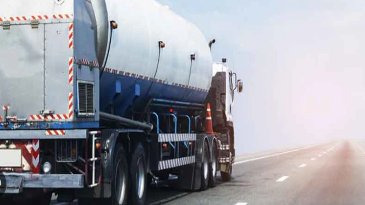 A tanker truck drives on a highway under a clear sky, representing Mobius Renewables' commitment to sustainable transportation.
