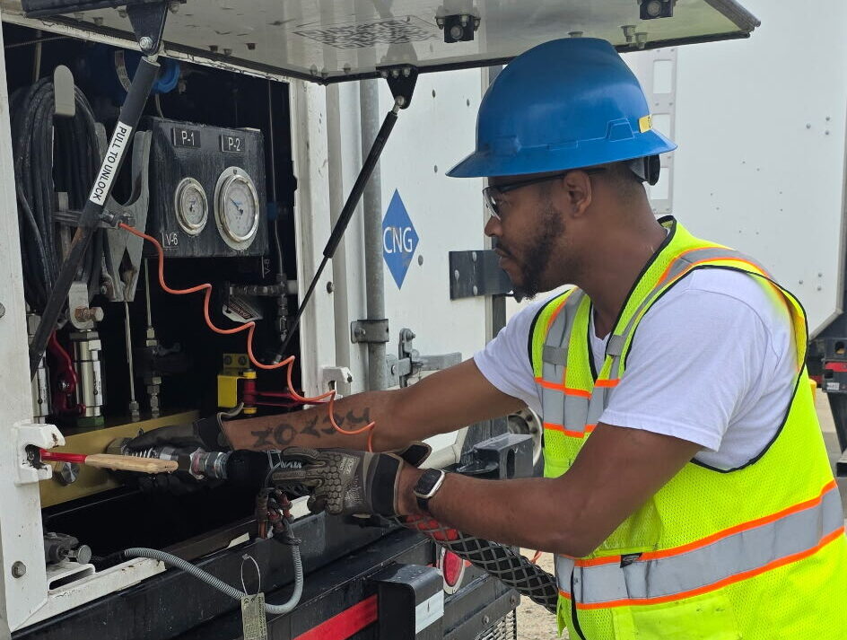 Gentleman offloading gas into truck